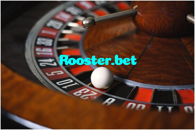 Rooster.bet casino presented on mobile device in Pakistan with slots and live games